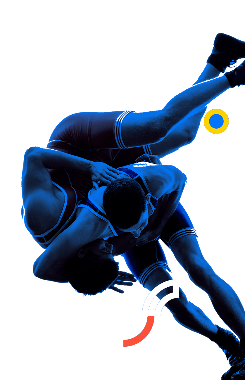 In the picture, a male wrestler is applying a maneuver making his contrincant fall.
