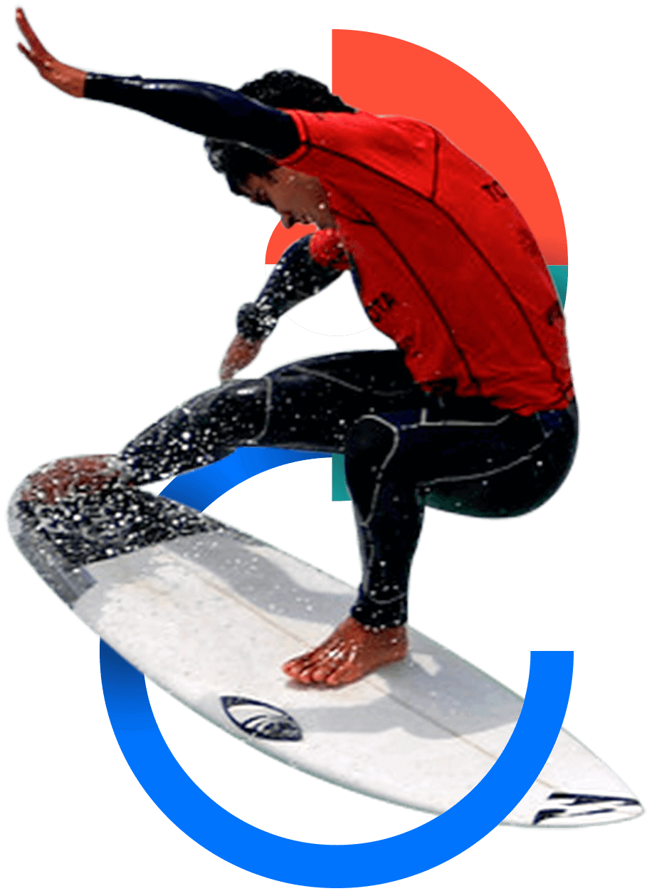 In the picture, a male surfer making a stunt with his board.